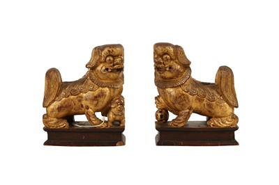 Lot 592 - A PAIR OF CHINESE CARVED GILTWOOD TEMPLE DOGS, LATE 19TH/EARLY 20TH CENTURY