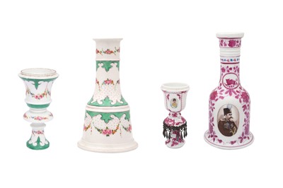 Lot 39 - TWO POLYCHROME-PAINTED CERAMIC WATERPIPE (QALYAN) BASES AND THEIR STEMS