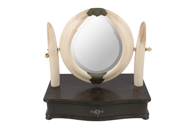 Lot 65 - A HIPPOPOTAMUS TUSK SWING FRAME TOILET MIRROR, CIRCA 1940S
