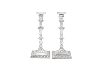 Lot 496 - A large pair of early George III sterling silver candlesticks, London 1764 by John Hyatt (Grimwade 1369)