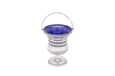 Lot 433 - A George III sterling silver sugar basket, London 1808 by John Edwards