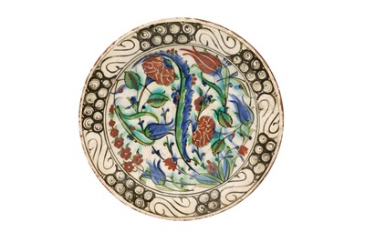 Lot 314 - AN IZNIK DISH WITH FLORAL TRIUMPH