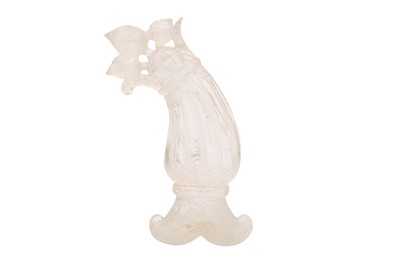 Lot 538 - A MUGHAL-STYLE CARVED ROCK CRYSTAL DAGGER HILT