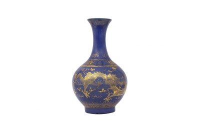 Lot 249 - A CHINESE POWDER-BLUE GILT-DECORATED 'DRAGON' BOTTLE VASE.