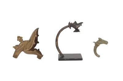 Lot 391 - A GROUP OF THREE MYTHICAL CREATURES' HEADS