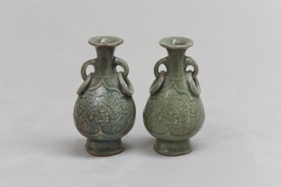 Lot 67 - A PAIR OF CHINESE CELADON-GLAZED BOTTLE VASES.