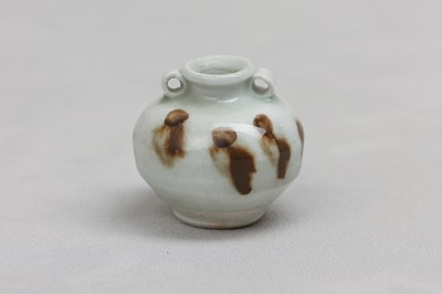 Lot 55 - A CHINESE RUSSET-SPLASHED QINGBAI JARLET.