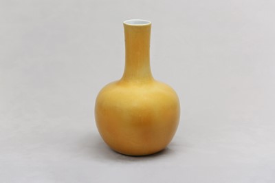 Lot 21 - A CHINESE LEMON-YELLOW GLAZED BOTTLE VASE.