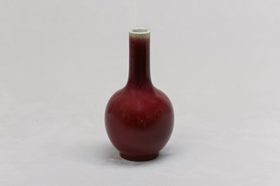 Lot 92 - A CHINESE OX BLOOD-GLAZED BOTTLE VASE.