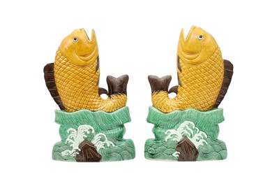 Lot 360 - A PAIR OF CHINESE SANCAI-GLAZED 'FISH' VASES.