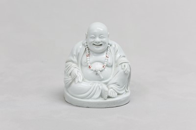 Lot 28 - A CHINESE BLANC-DE-CHINE FIGURE OF BUDAI HESHANG.