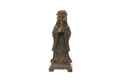 Lot 406 - A CHINESE PARCEL-GILT BRONZE FIGURE OF AN OFFICIAL.