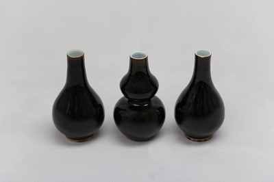 Lot 78 - THREE CHINESE MIRROR BLACK-GLAZED VASES.