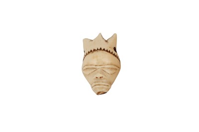 Lot 447 - A CONGOLESE PENDE MASK PENDANT