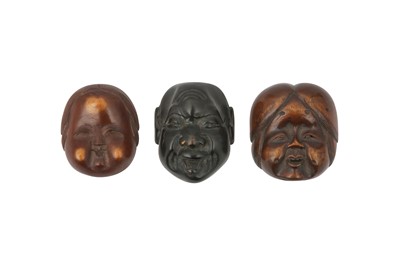 Lot 421 - THREE JAPANESE WOOD 'MASK' NETSUKE.