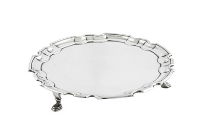 Lot 558 - A George II Scottish sterling silver waiter or teapot stand, Edinburgh 1735 by James Kerr