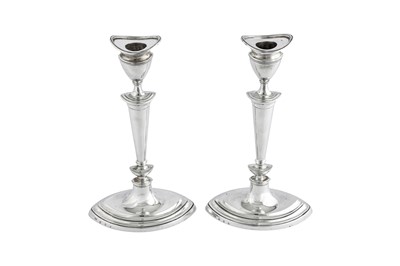 Lot 490 - A pair of Edwardian Scottish sterling silver candlesticks, Edinburgh 1906 by Hamilton and Inches