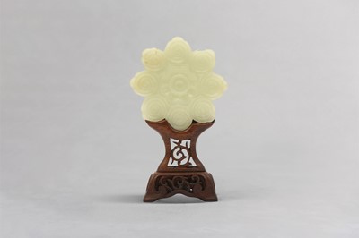 Lot 44 - A CHINESE CARVED JADE 'FLOWER' PLAQUE.