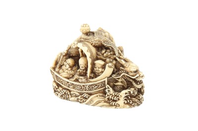 Lot 420 - λ A JAPANESE IVORY 'TAKARABUNE' NETSUKE BY RYUKEI II.