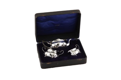 Lot 472 - A cased George V sterling silver three-piece tea service, Birmingham 1913 by Williams Birmingham Ltd