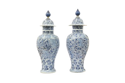 Lot 234 - A PAIR OF LARGE CHINESE BLUE AND WHITE VASES AND COVERS.