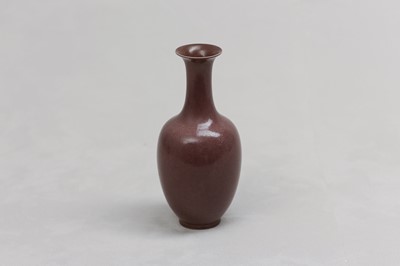 Lot 89 - A CHINESE AUBERGINE-GLAZED 'DRAGON' BOTTLE VASE.