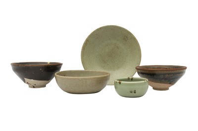 Lot 568 - THREE CHINESE CELADON-GLAZED BOWLS AND TWO JIAN-STYLE BOWLS.