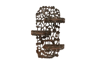 Lot 429 - A CHINESE CARVED WOOD 'PRUNUS' DISPLAY SHELF