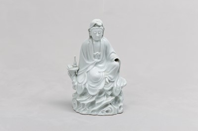 Lot 29 - A CHINESE BLANC-DE-CHINE FIGURE OF GUANYIN.