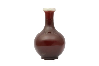 Lot 322 - A CHINESE SANG DE BOEUF-GLAZED BOTTLE VASE.