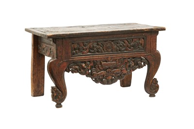 Lot 823 - A TIBETAN LOW POLYCHROMED WOOD OFFERING TABLE.