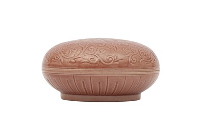 Lot 262 - A CHINESE CIRCULAR COPPER RED-GLAZED 'LOTUS' BOX AND COVER.