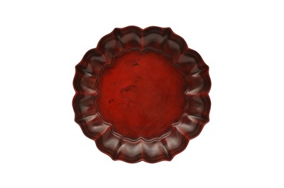 Lot 795 - A CINNABAR LACQUER LOBED DISH.