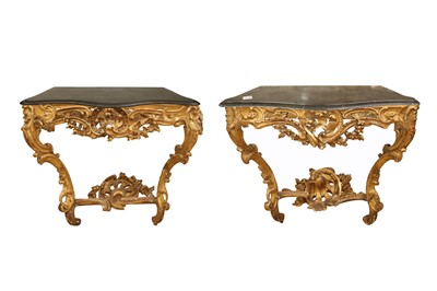Lot 84 - A NEAR PAIR OF 18TH CENTURY ROCOCO STYLE GILTWOOD CONSOLE TABLES