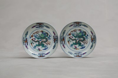 Lot 245 - A PAIR OF CHINESE DOUCAI 'DRAGON' SAUCER DISHES.