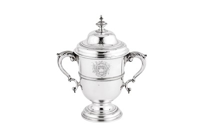 Lot 695 - A George II sterling silver twin handled cup and cover, London 1749 by Fuller White (reg. 31st Dec 1744)