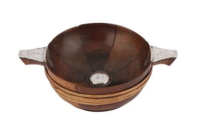 Lot 569 - An early 18th century Scottish unmarked silver mounted quaich, circa 1710