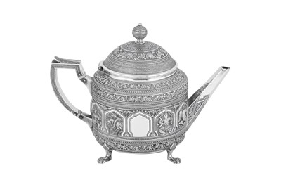 Lot 560 - A Victorian Scottish sterling silver 'Burmese pattern' teapot, Edinburgh 1876 by Edwin Millidge and Sons
