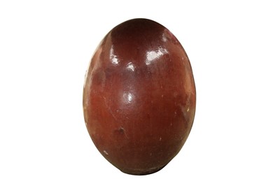 Lot 214 - A SANG DE BOEUF GLAZED TERRACOTTA 'DRAGON' EGG GARDEN SCULPTURE