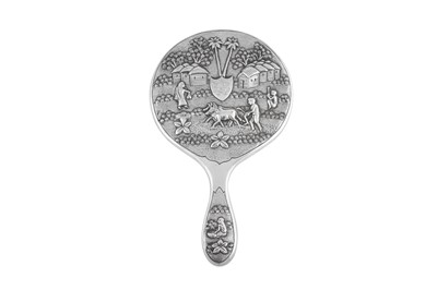 Lot 123 - An early 20th century Anglo - Indian silver hand mirror, Calcutta circa 1920