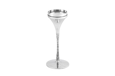 Lot 443 - An Elizabeth II modernist sterling silver candlestick, London 1973 by Stuart Devlin (1931-2018)