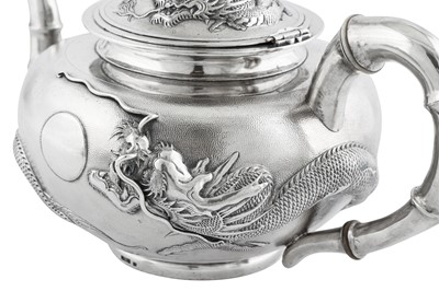 Lot 235 - An early 20th century Chinese Export silver three-piece tea service on a twin handled tray, Shanghai dated 1926 retailed by Zee Woo