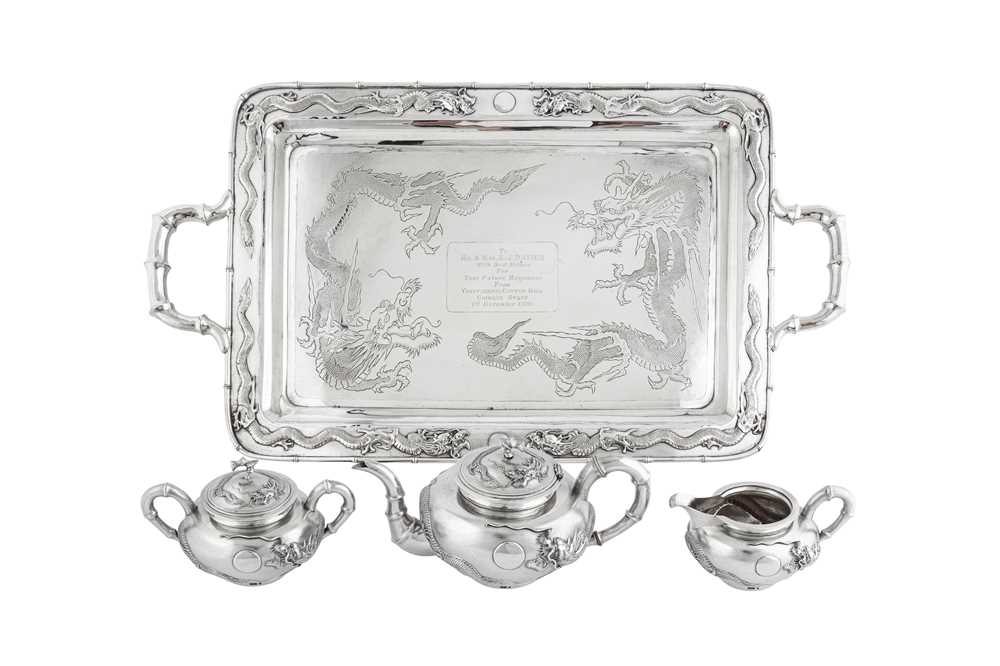Lot 235 - An early 20th century Chinese Export silver three-piece tea service on a twin handled tray, Shanghai dated 1926 retailed by Zee Woo