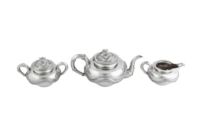 Lot 235 - An early 20th century Chinese Export silver three-piece tea service on a twin handled tray, Shanghai dated 1926 retailed by Zee Woo