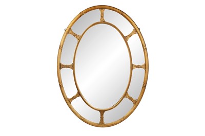 Lot 180 - A REGENCY STYLE OVAL SECTIONAL WALL MIRROR, LATE 19TH CENTURY