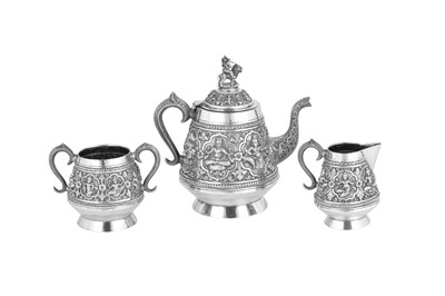 Lot 370 - A late 19th century Anglo - Indian unmarked silver three-piece tea service, Madras circa 1890