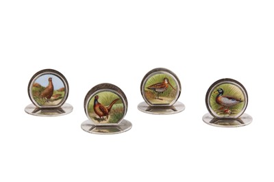 Lot 80 - A set of four Edwardian sterling silver and enamel menu holders, Chester 1905 by Sampson Mordan and Co