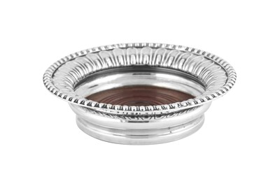 Lot 527 - A Victorian sterling silver wine coaster, London 1900 by Alfred James How
