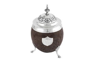 Lot 476 - A George III and William IV sterling silver coconut cup and cover, the mounts London 1791 by Thomas Phipps and Edward Robinson