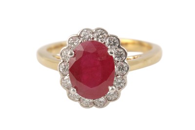 Lot 190 - A ruby and diamond cluster ring